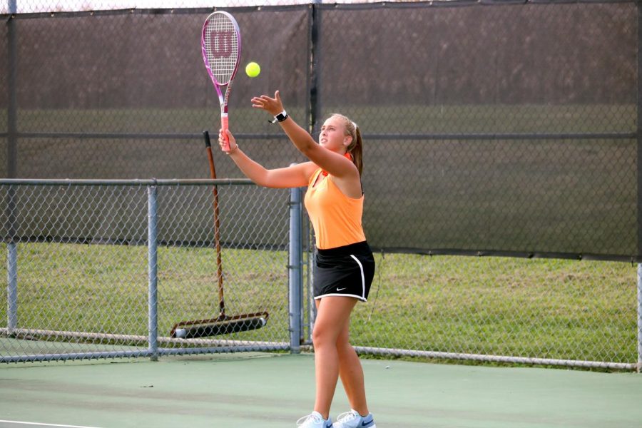 Rileigh Stevens shows her form as she serves the ball. 