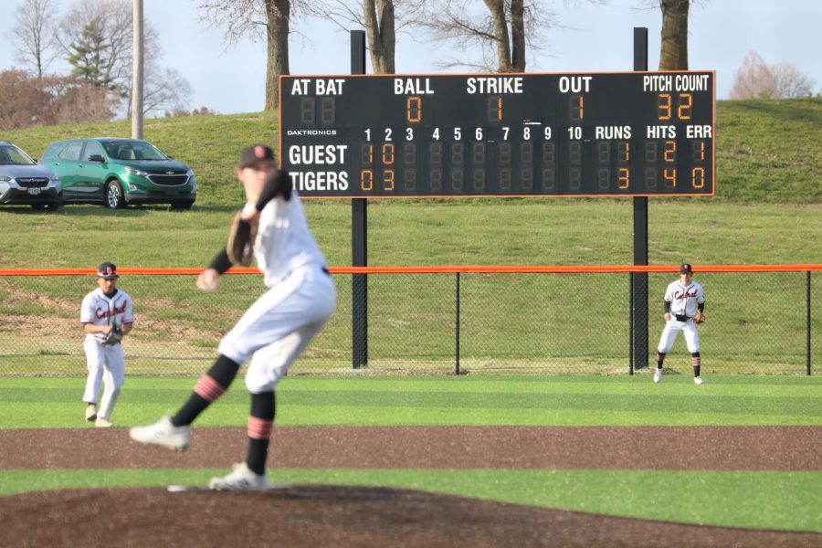 Senior Ty Thatcher (12) delivers a pitch against the Kennett Indians during the third inning.