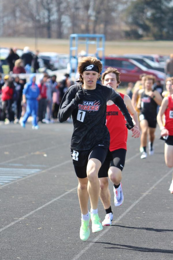 Ryan Seabaugh (11) passes his opponents during his first place finish in the boys 800m run.